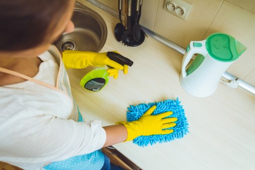 Cleaner using protective equipment during a carpet cleaning job
