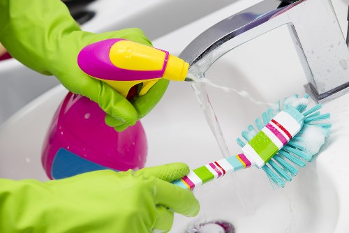 Office cleaners in Merton tidying a modern workplace